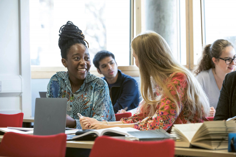students talking in seminar room