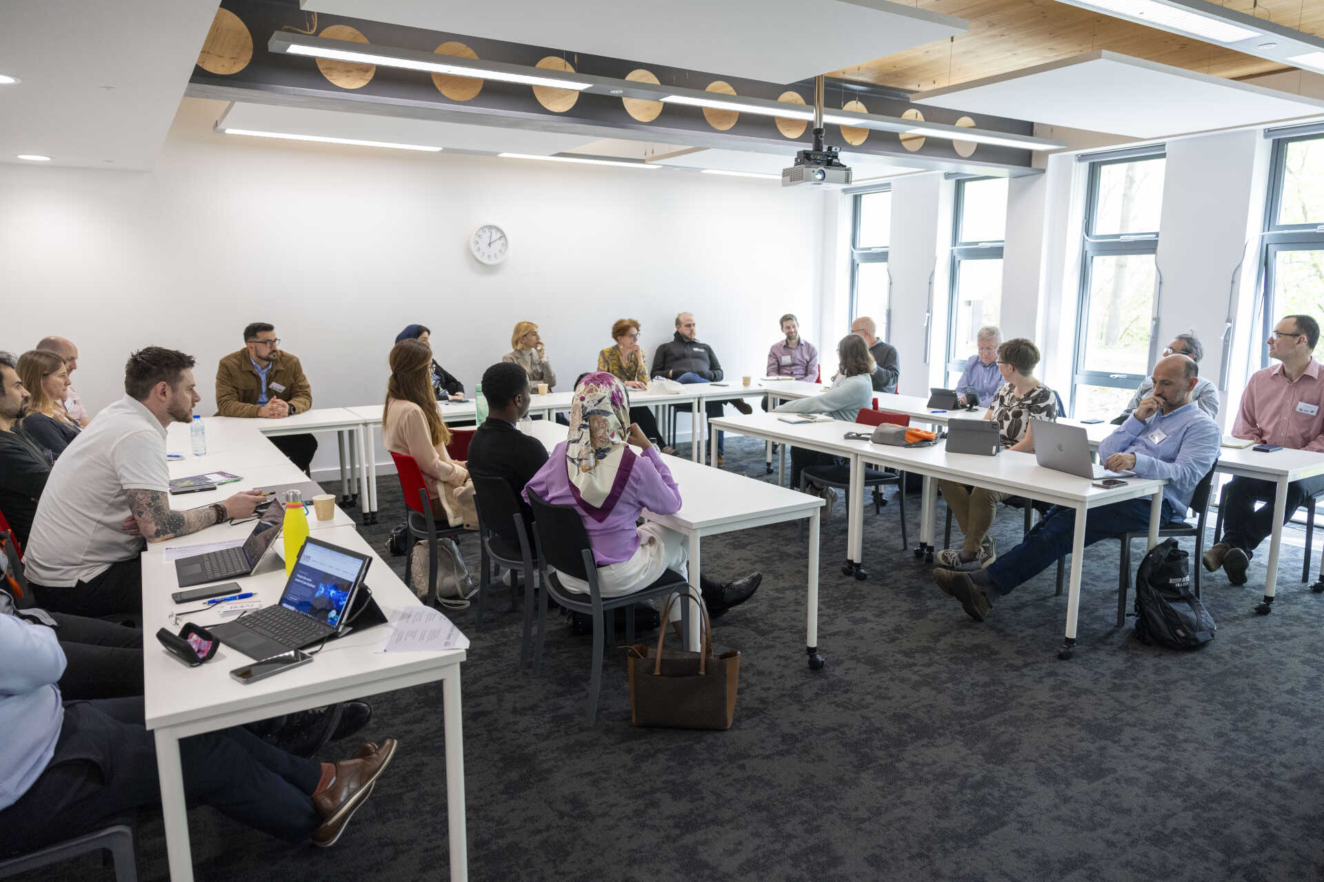 People in a seminar room having a discussion