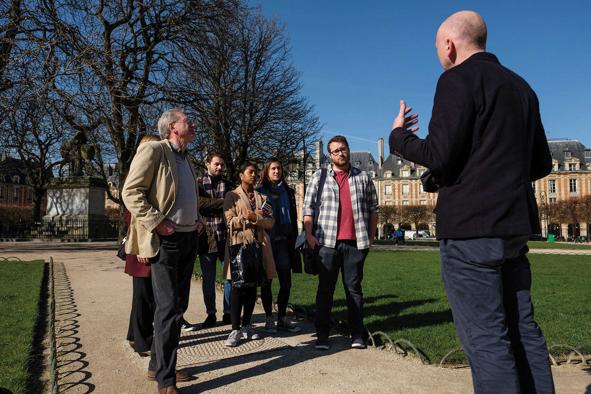 Students and academics talking in Paris park